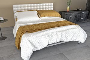 Modern bedroom decorated - furniture with flowers cup of tea and newspaper - tiles floor